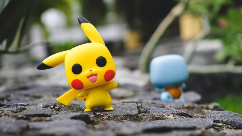 Two funko pop figures of two different pokemon characters.